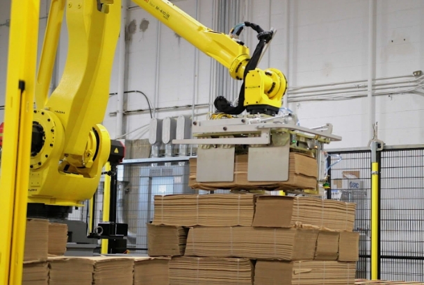 End-of-Arm Tooling Flexibility. A Robotic palletizer that is tooled to handle bundles.