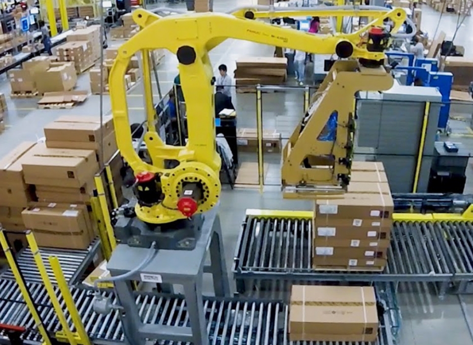 Robotic Palletizer working in a robotic palletizing cell.